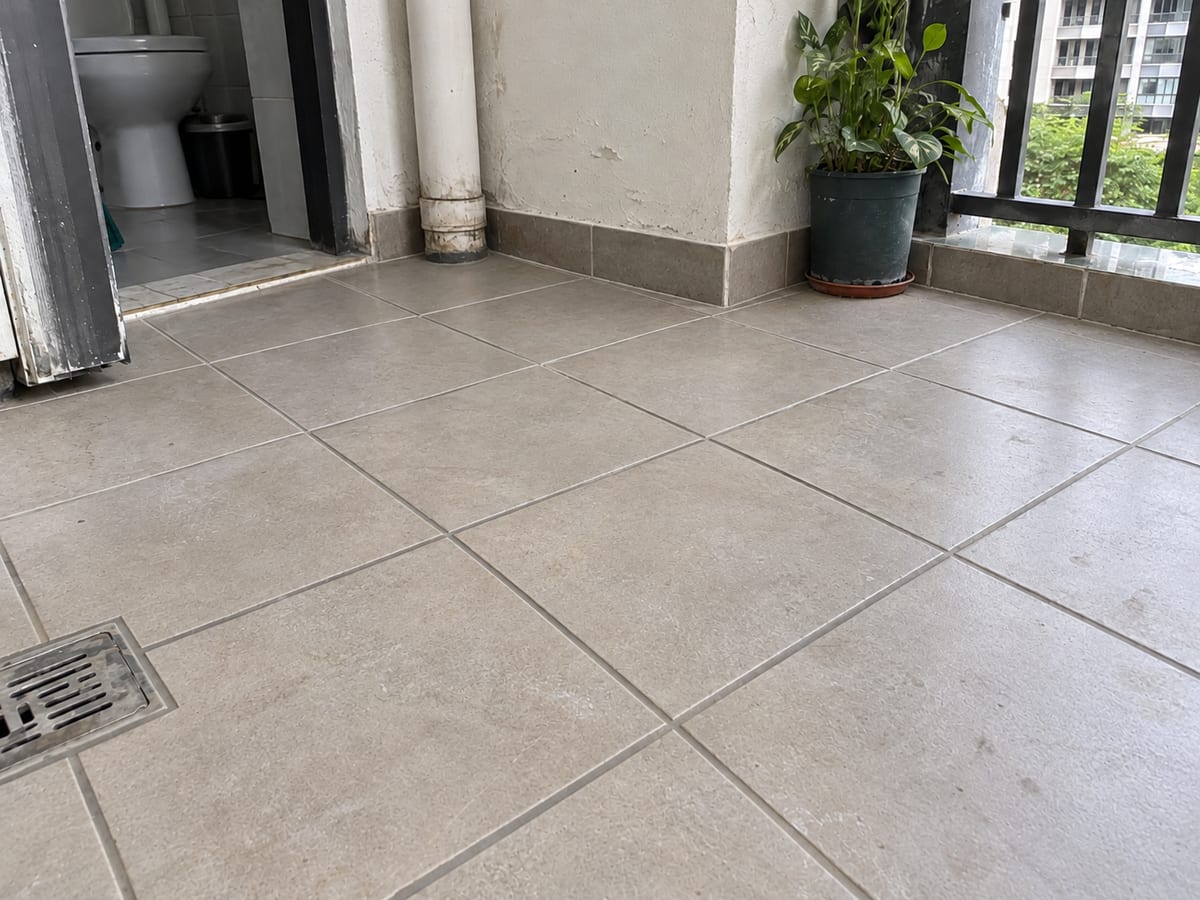 The same tiled floor after regrouting with renewed tile joints